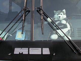 A toy husky on the dash of my motorcoach